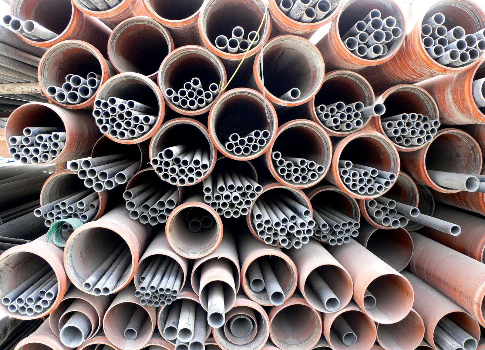 a bunch of pipes stacked up on top of each other