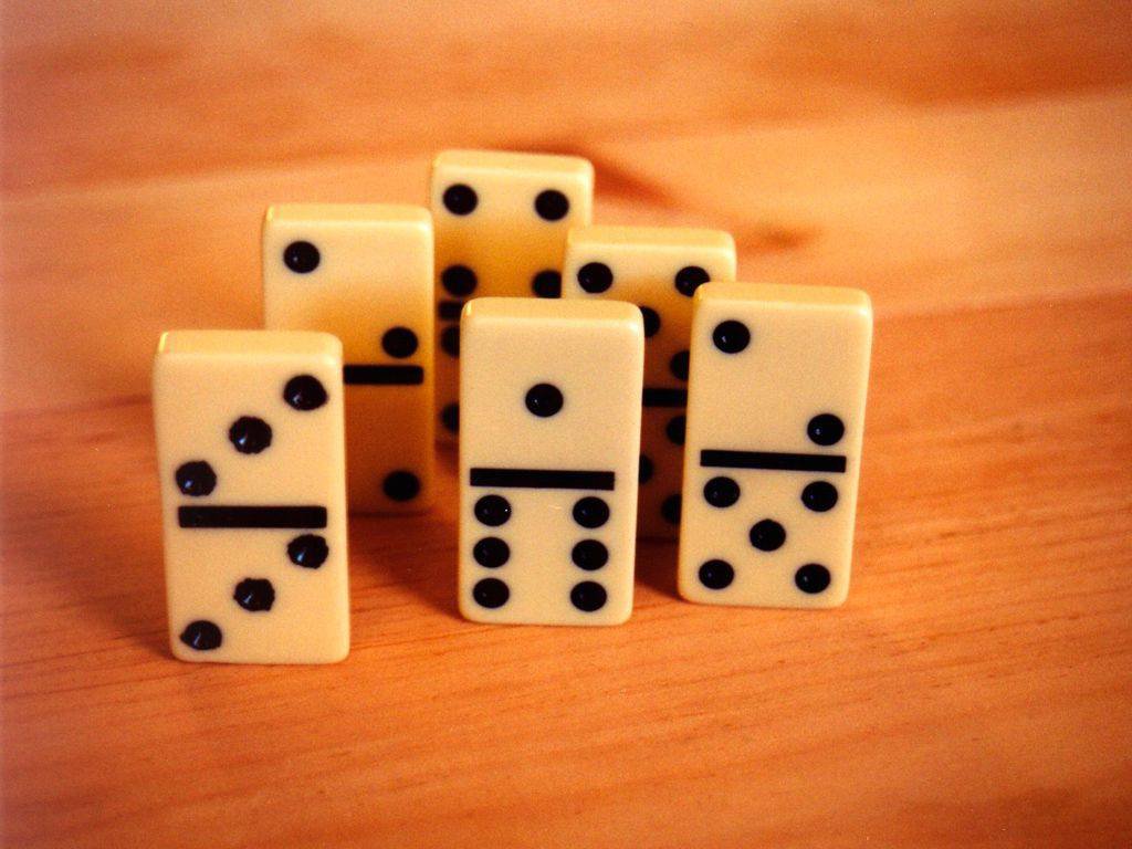 eight dice are arranged in the shape of four