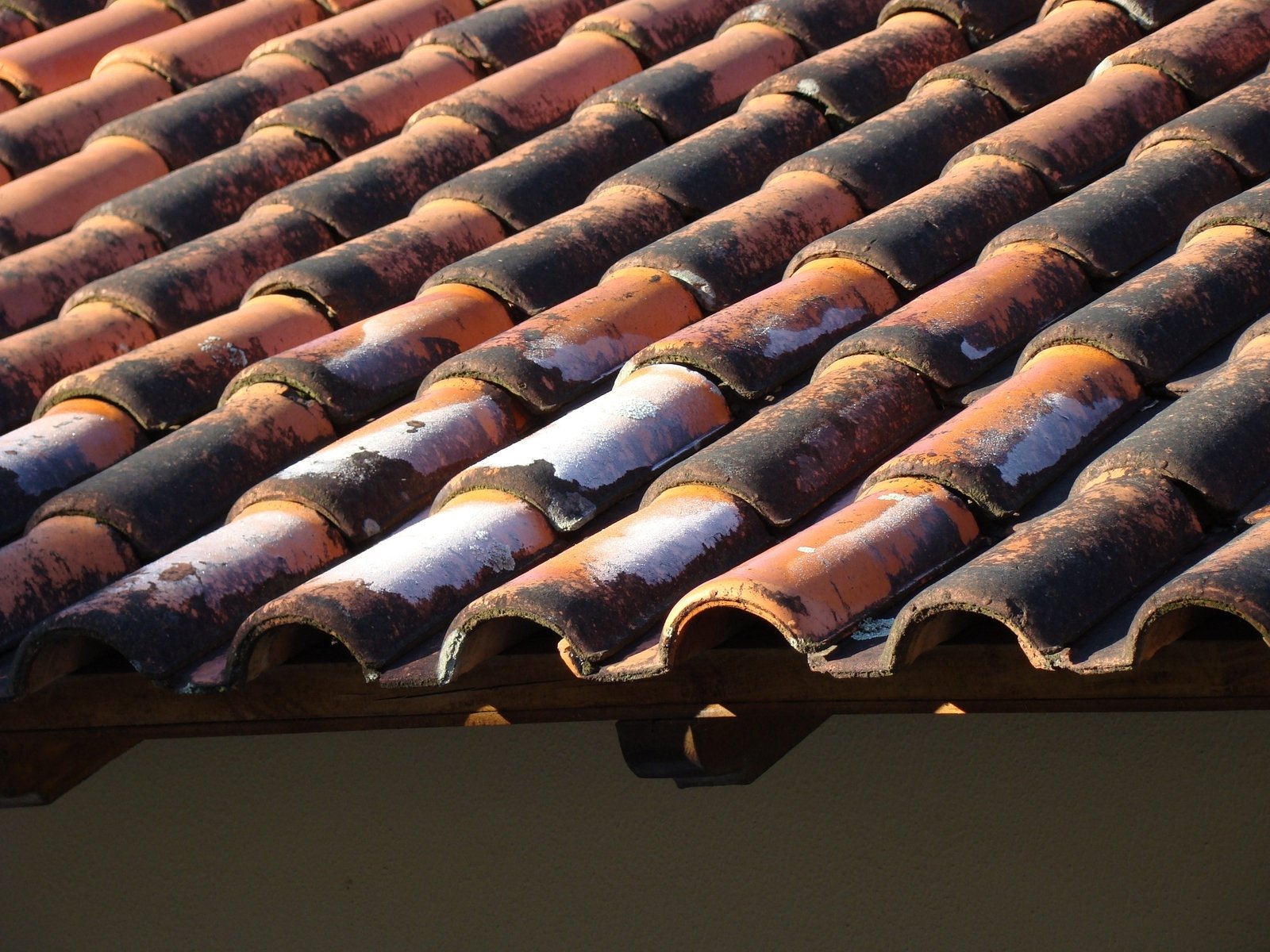 red tile roof with no leaks or rain gutter