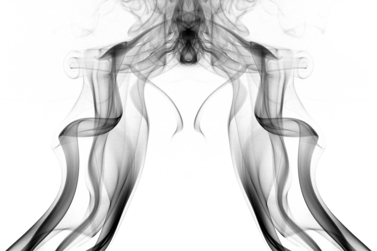 the smoke from a pipe with dark colors is black and white