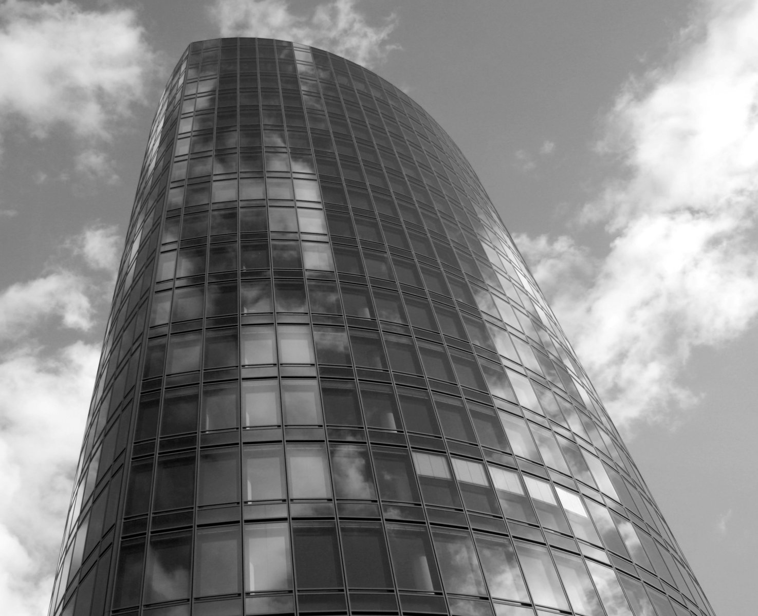 a black and white po of a glass and steel building