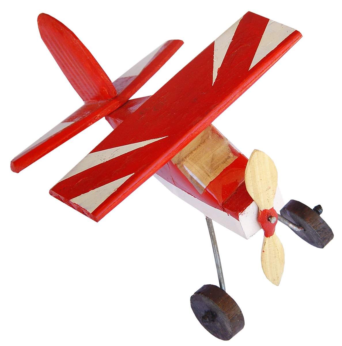 a toy airplane that is flying above the ground