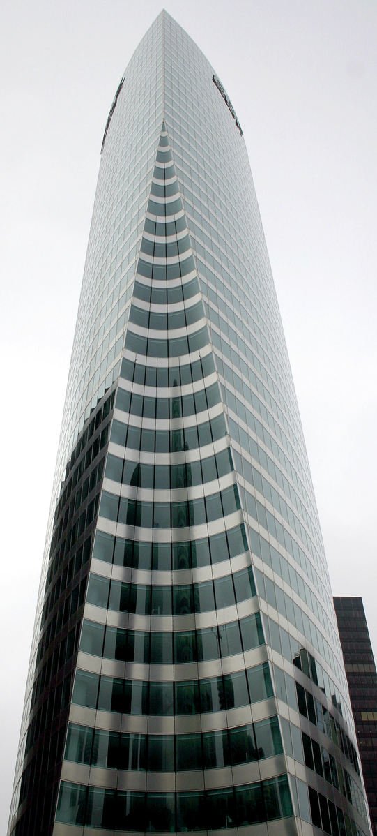 large black and white building against gray sky