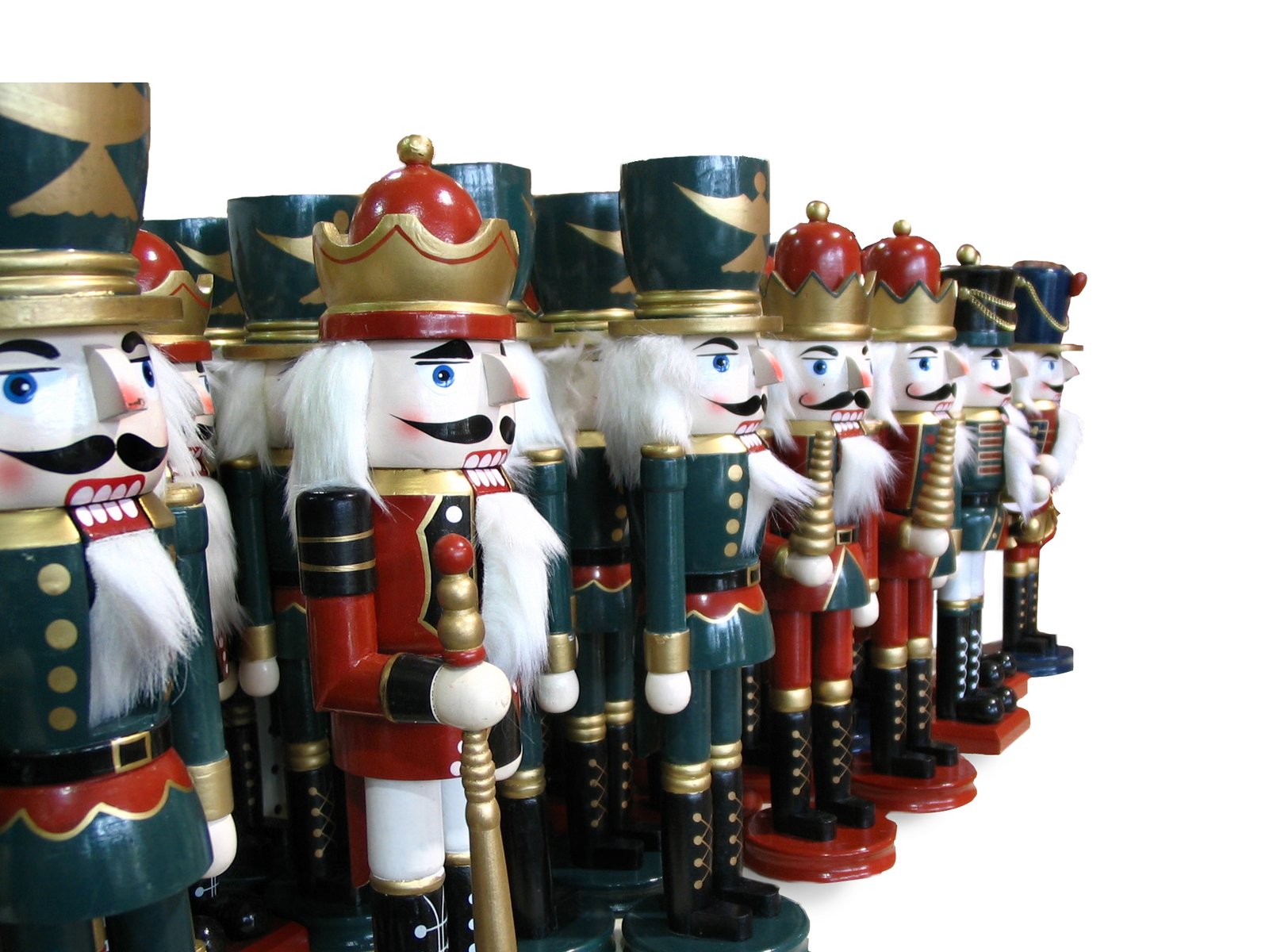 many different wooden toy nuters lined up on a white surface