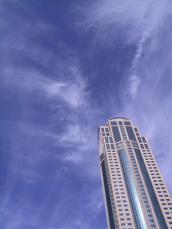 the sky above a very tall building