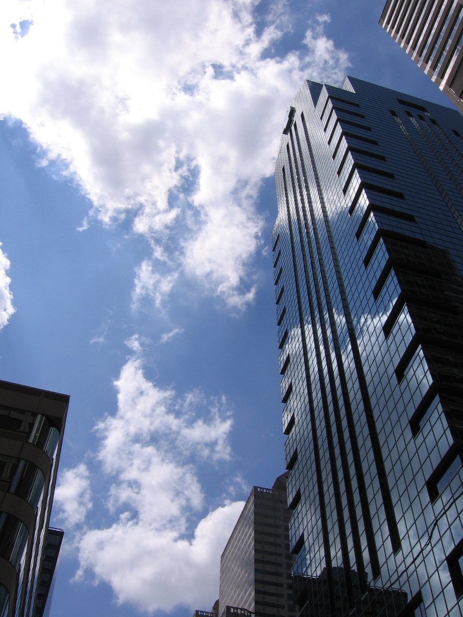 the very tall buildings are surrounded by other tall buildings