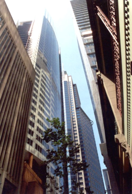 a city street with several tall buildings next to one another