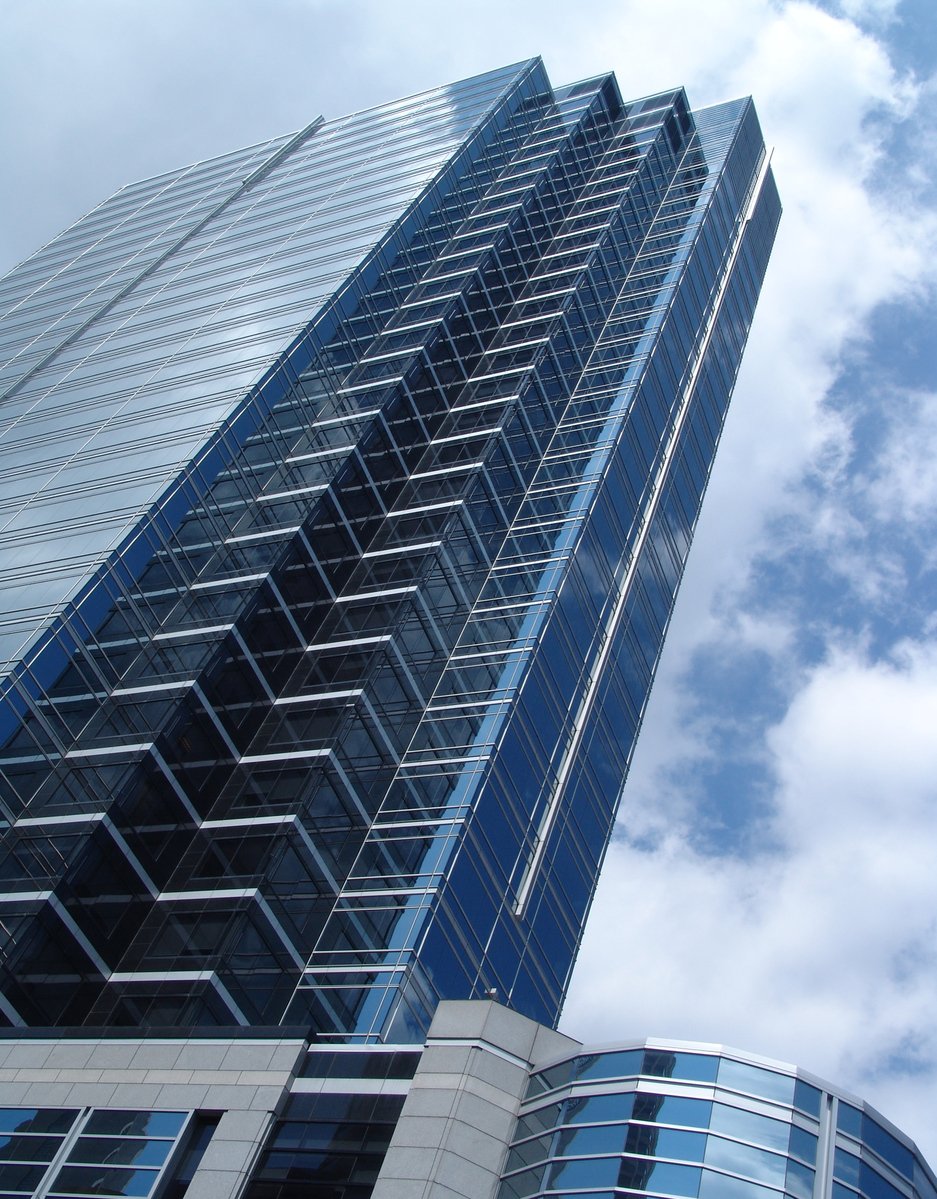 an image of a very tall blue building