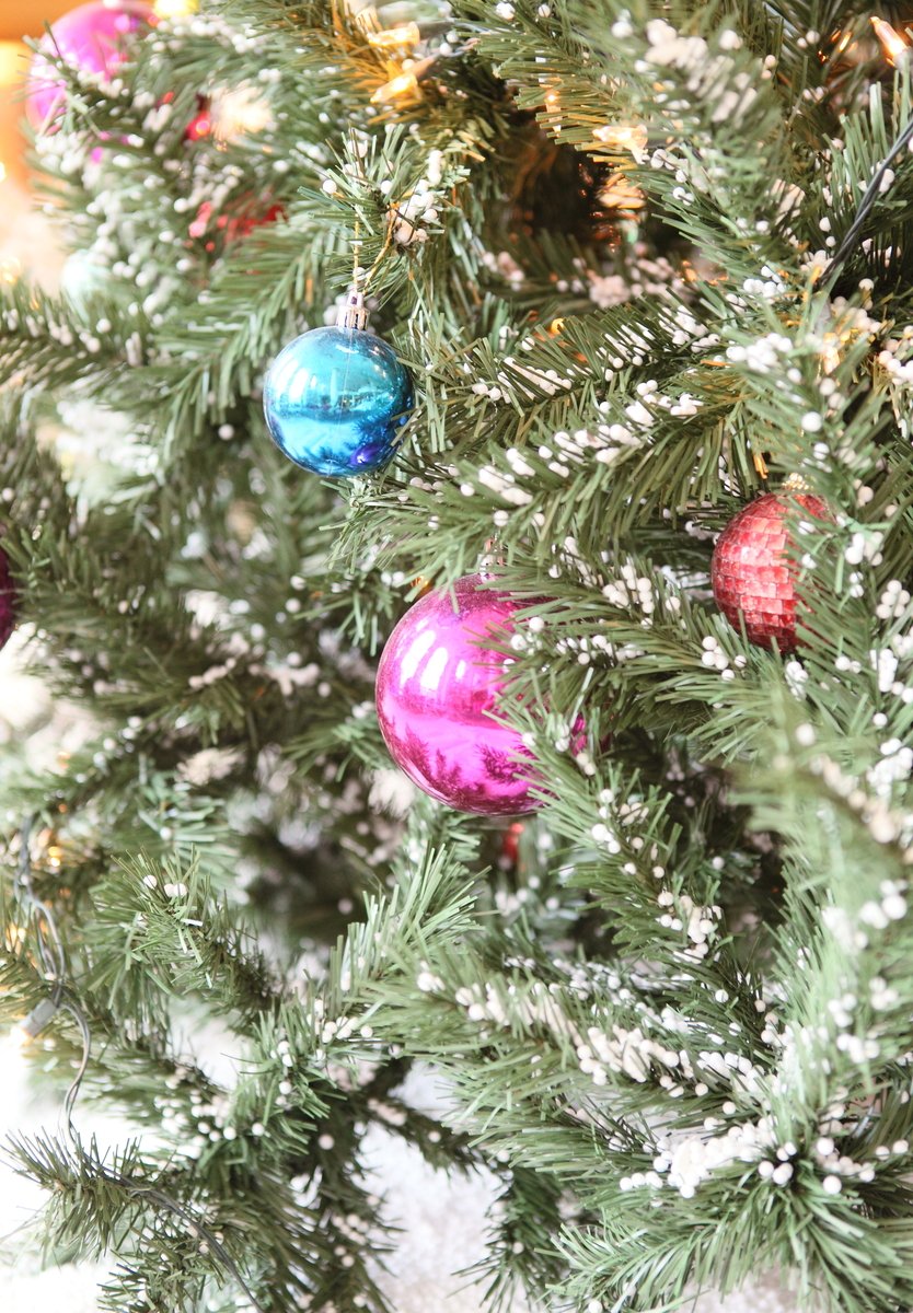 a decorated christmas tree with ornaments all over