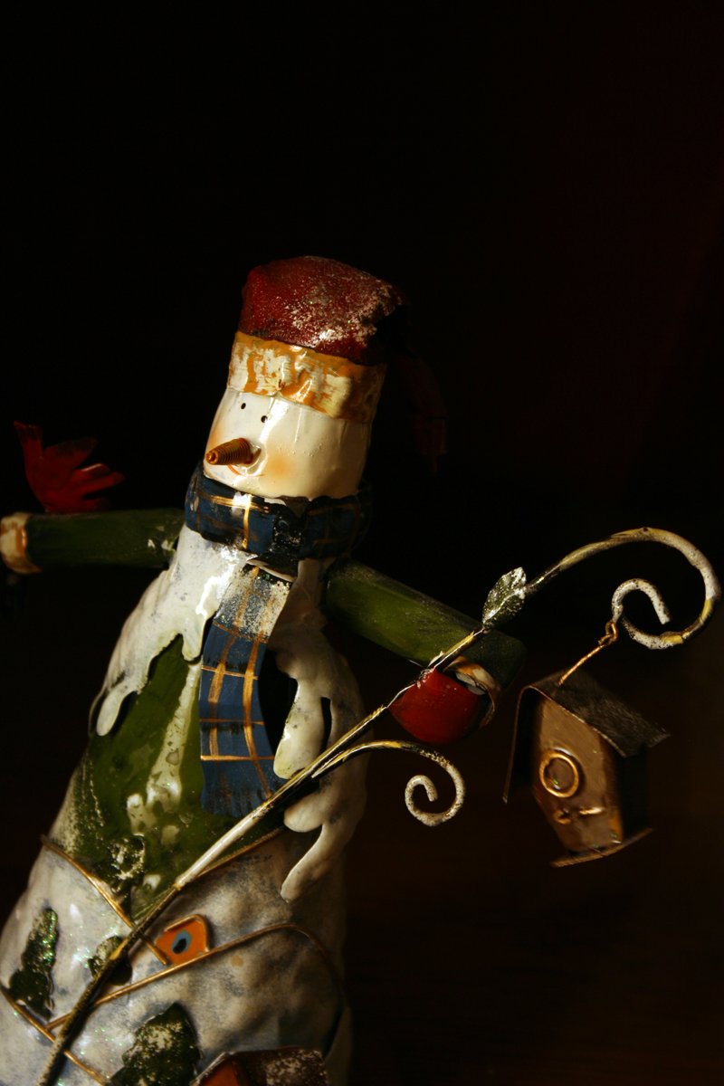 a figurine with a red hat and blue jacket