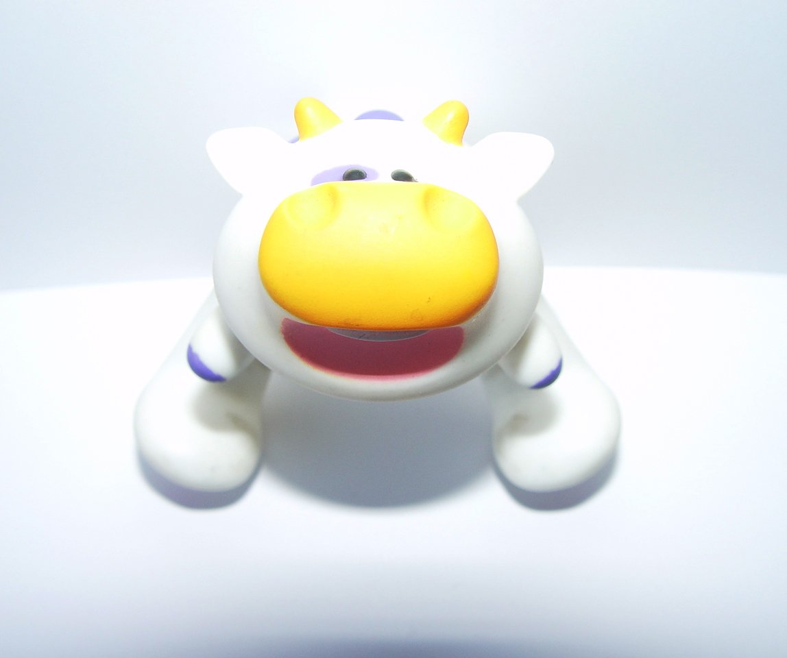 a toy figure sitting on top of a white table