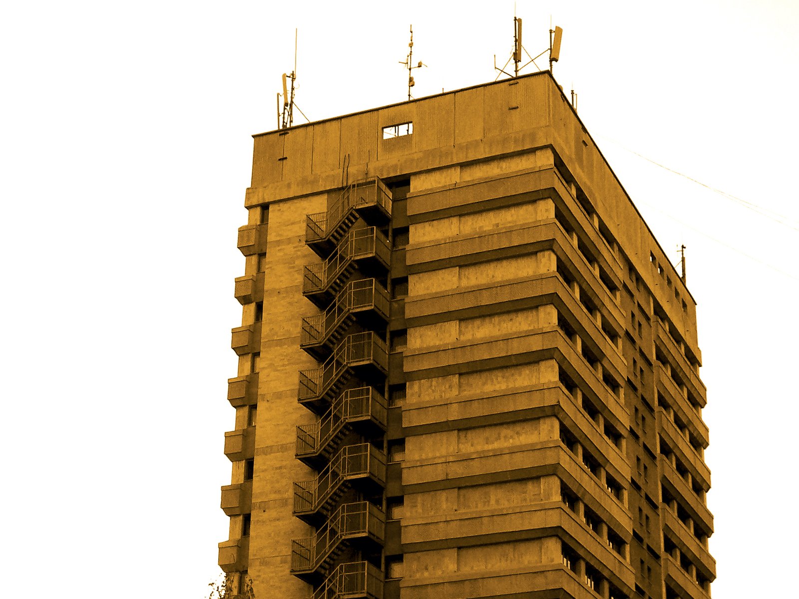 a large tall building with two floors and balconies