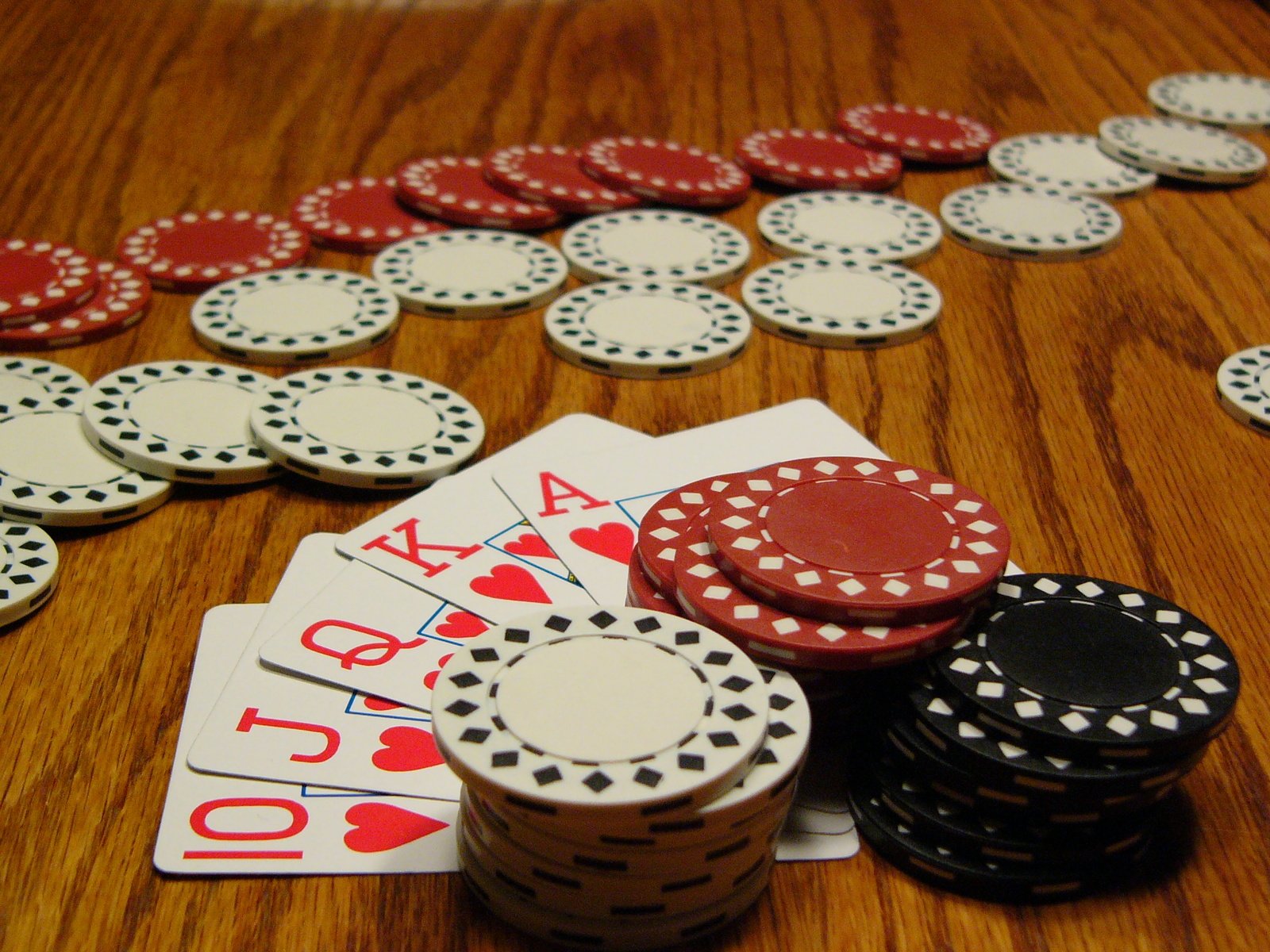 a table topped with cards and casino chips