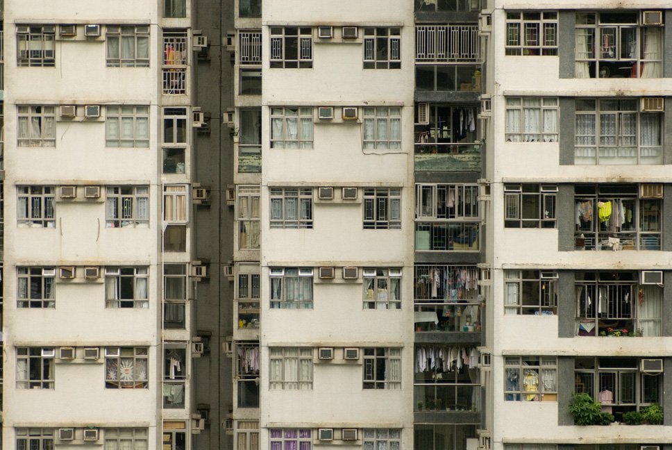 many apartment buildings filled with windows and balconies