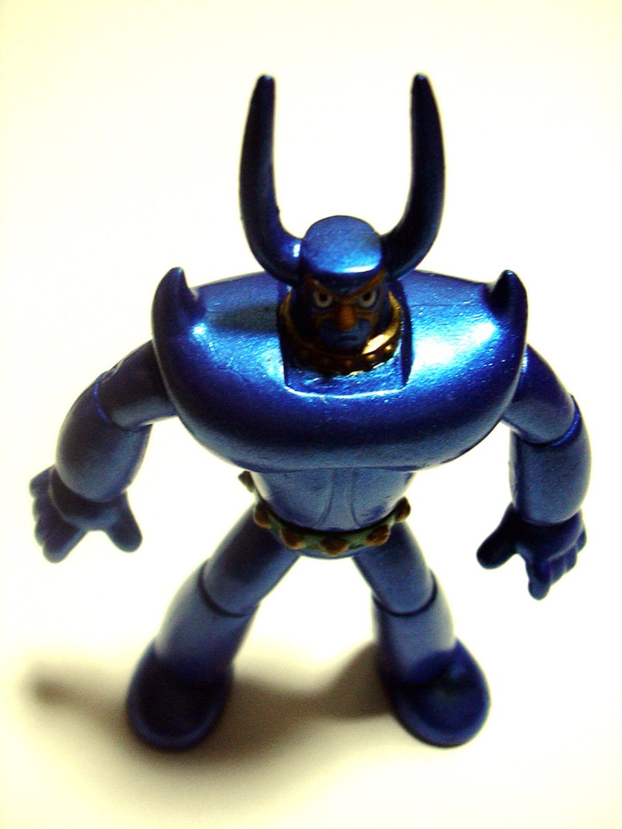 a toy with a small blue object on it's head