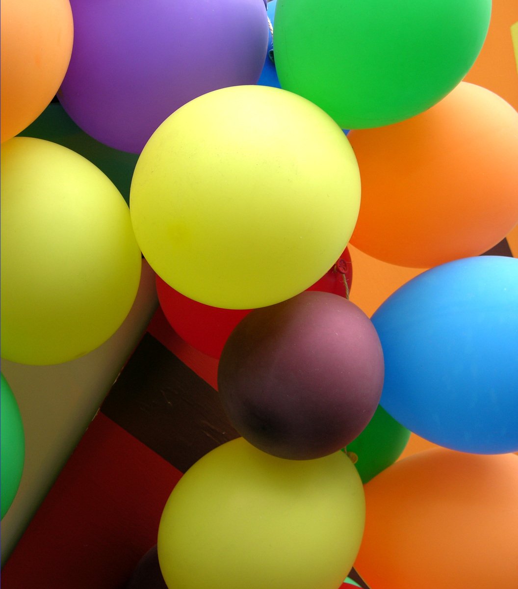 a group of balloons sit next to each other