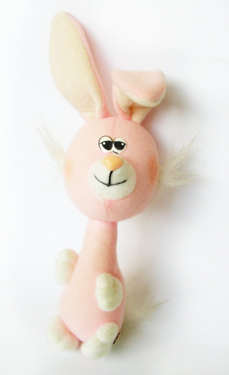 a pink toy with large ears and an orange nose