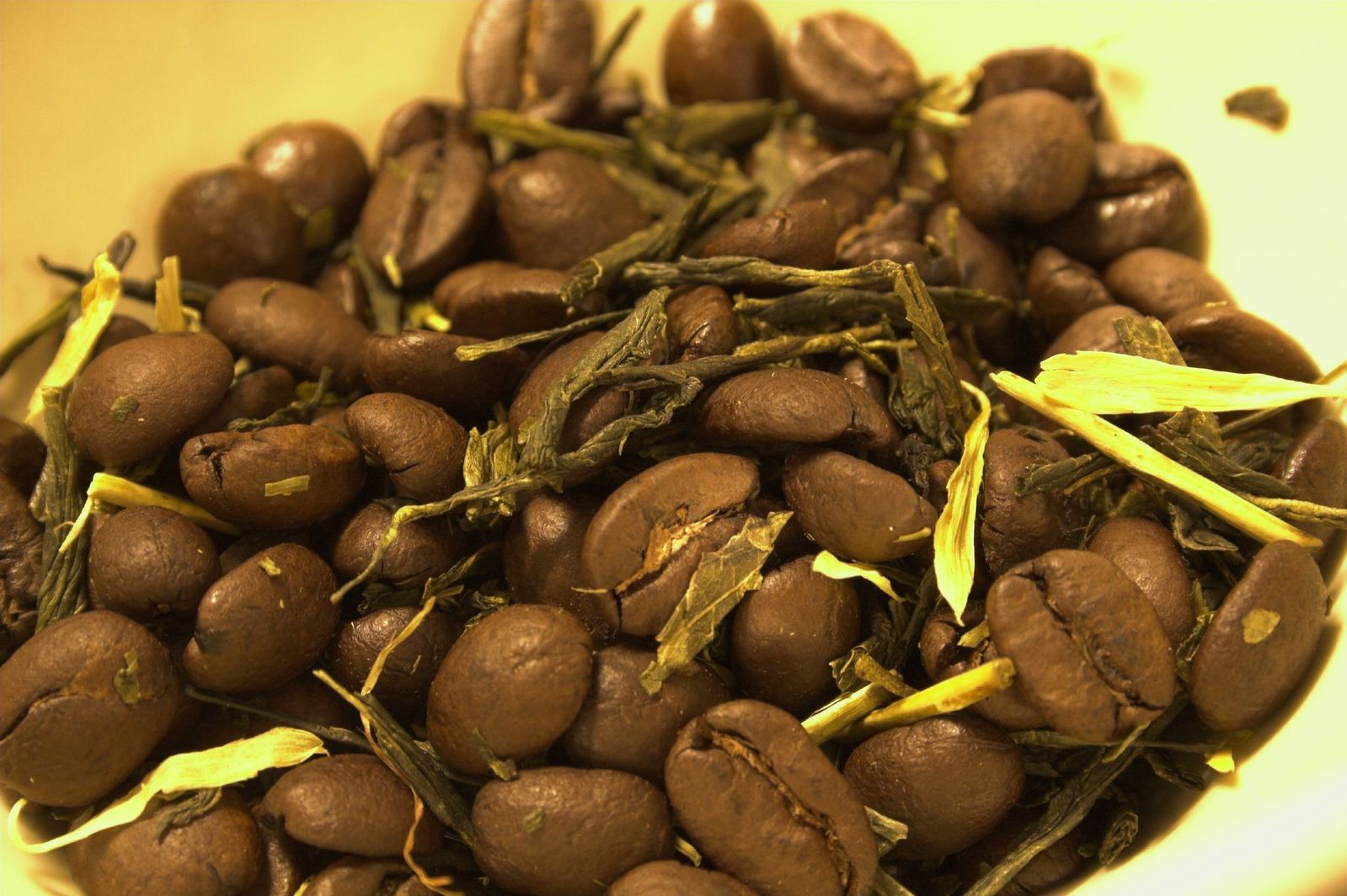 close up view of green tea beans in bowl