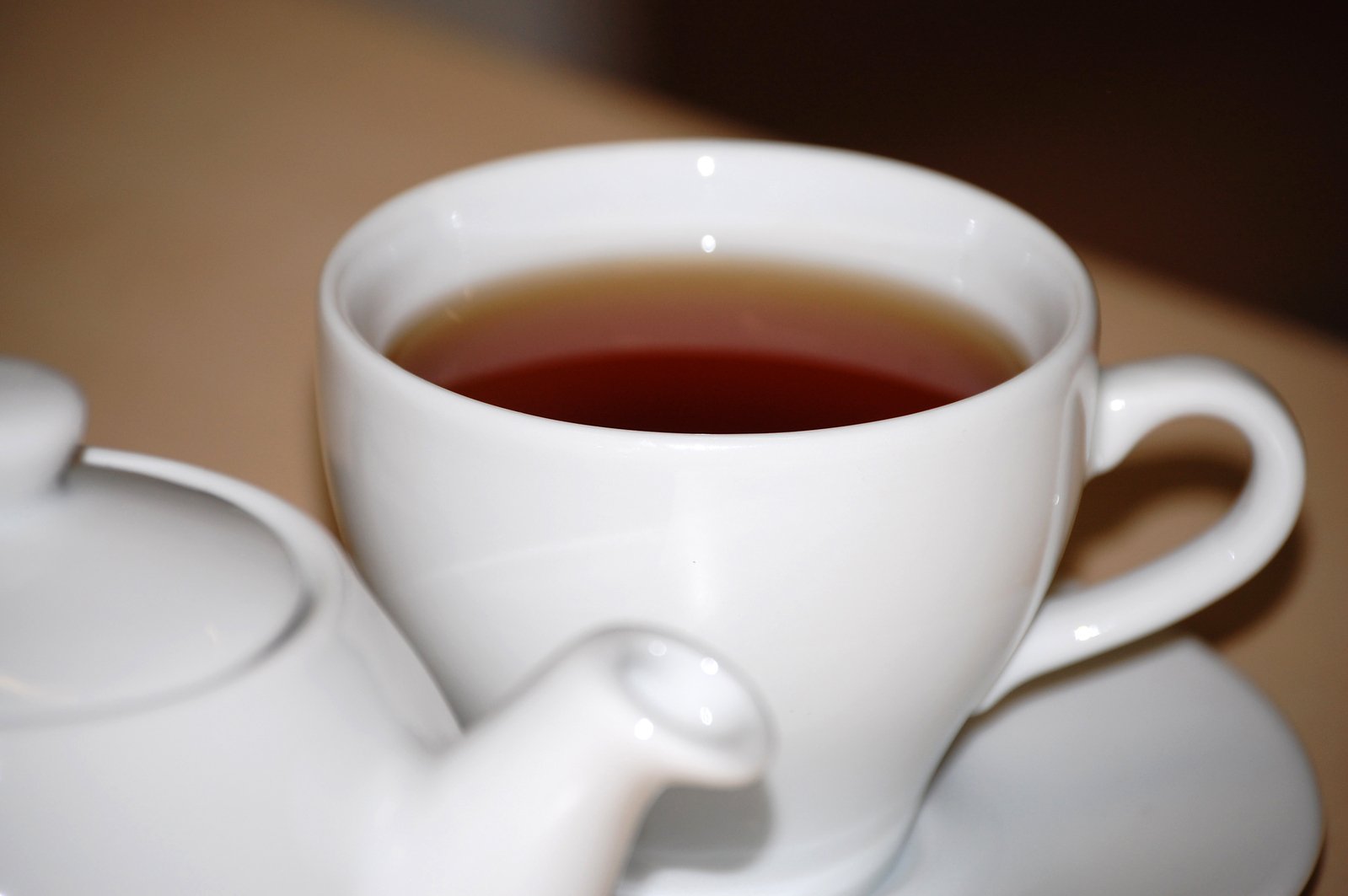 a cup of tea sits on a saucer