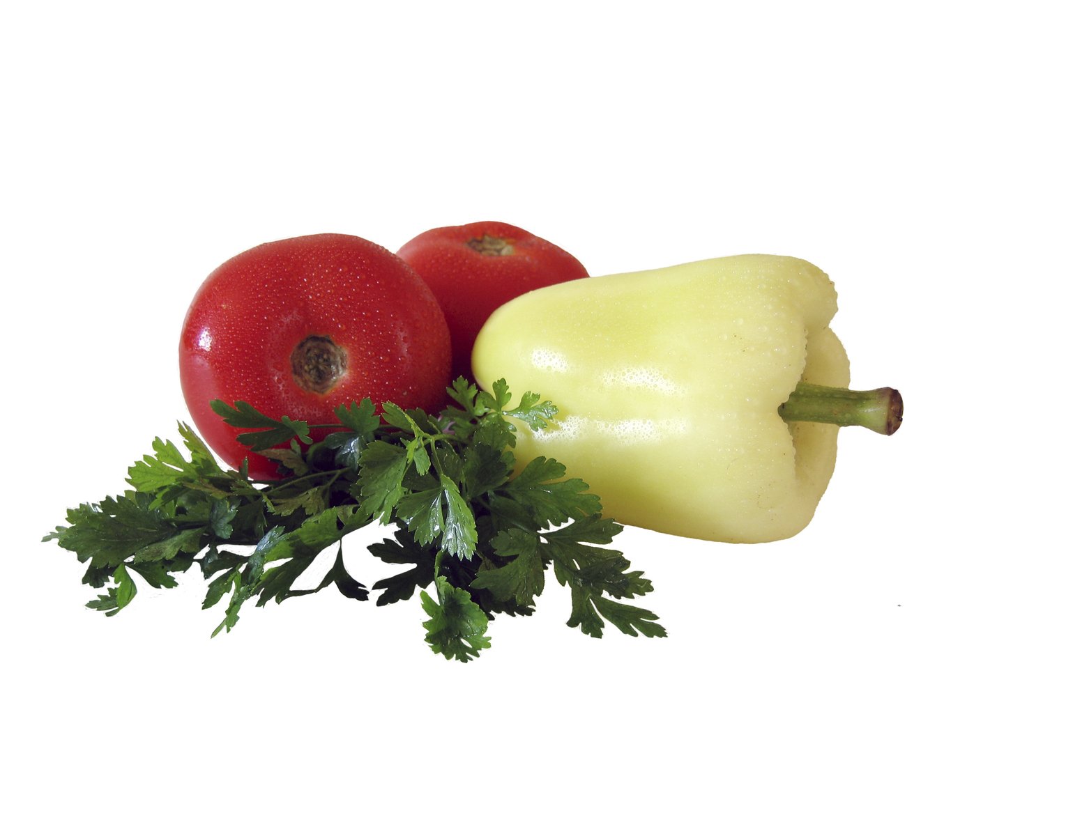 two peppers and a yellow pepper on top of some parsley