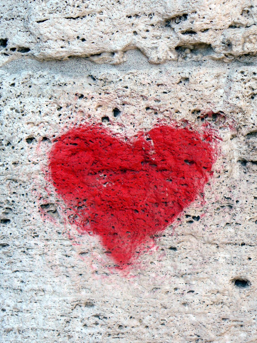 a red heart on the side of the wall