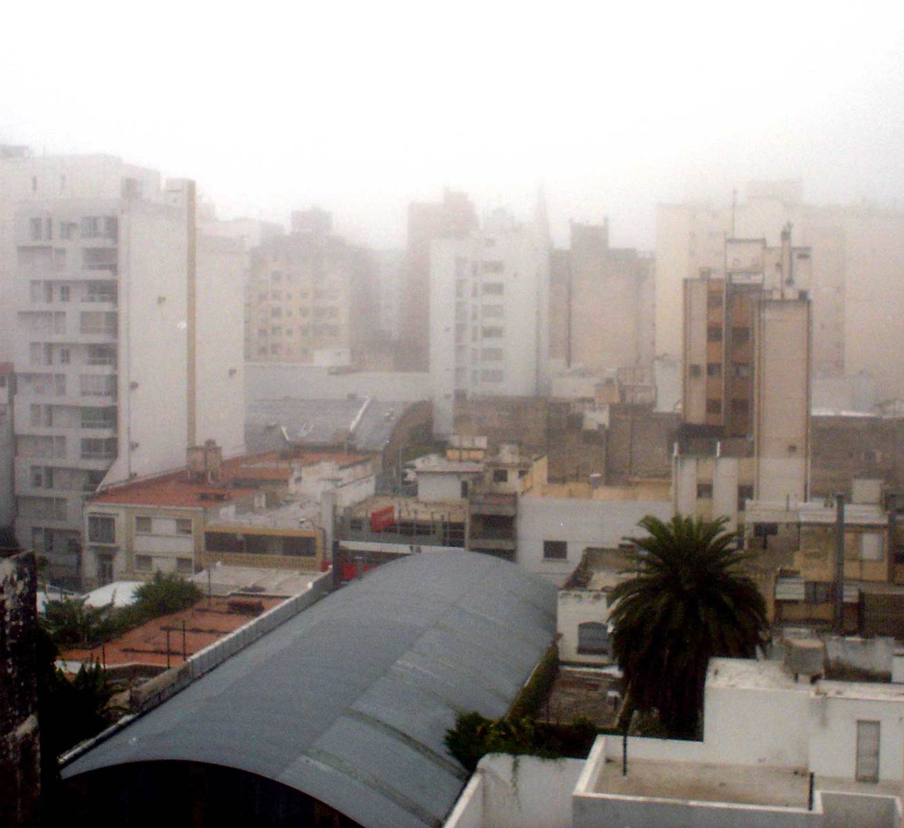 an image of city buildings on a hazy day