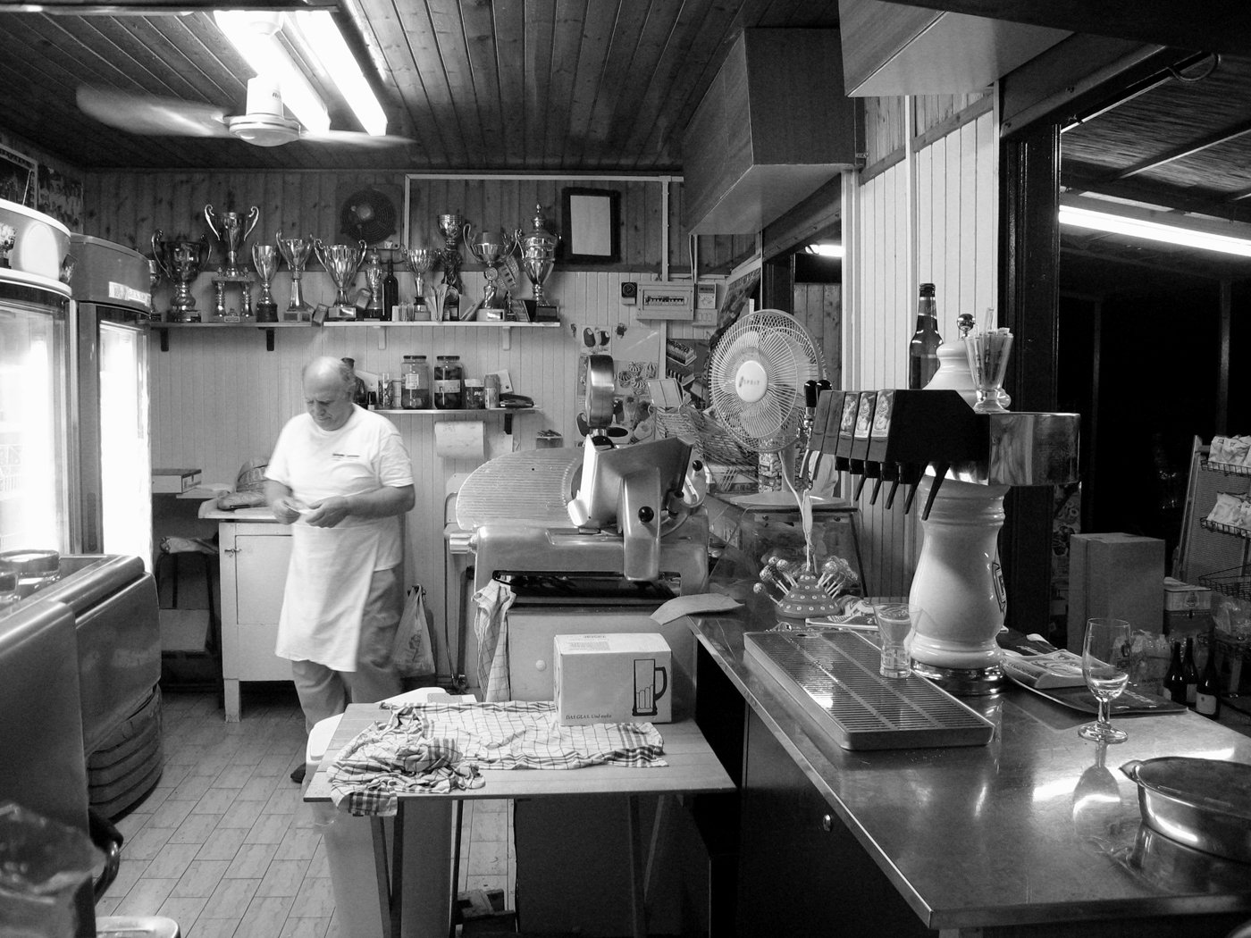 a black and white image of a chef in a kitchen