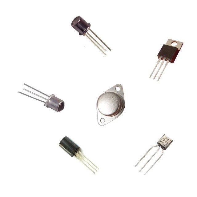 various types of electronic components are laying on a white surface