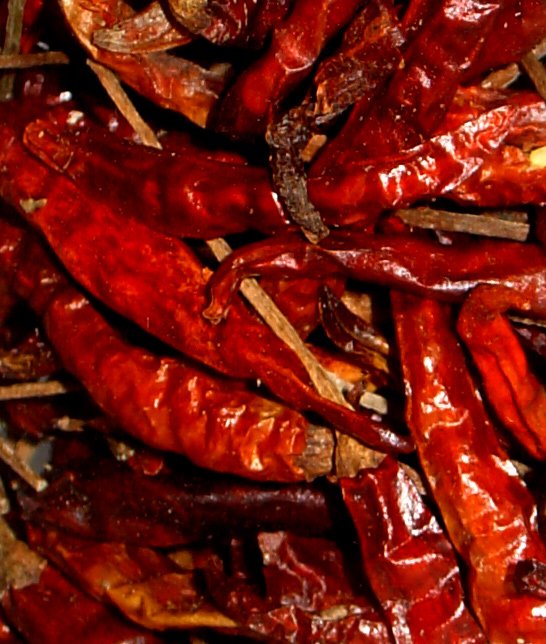 closeup of red peppers covered in red wax