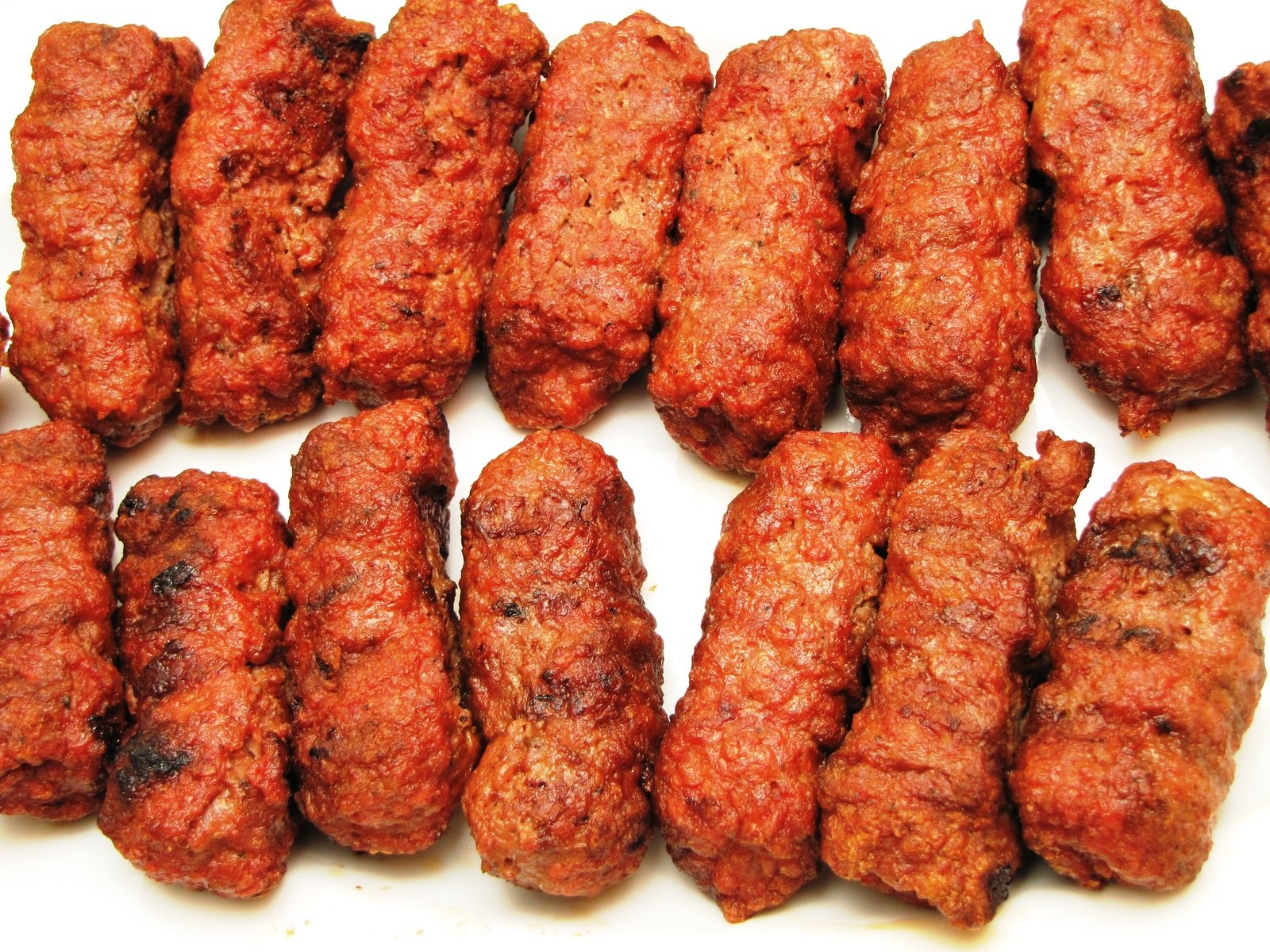 meat on skewers with a white background
