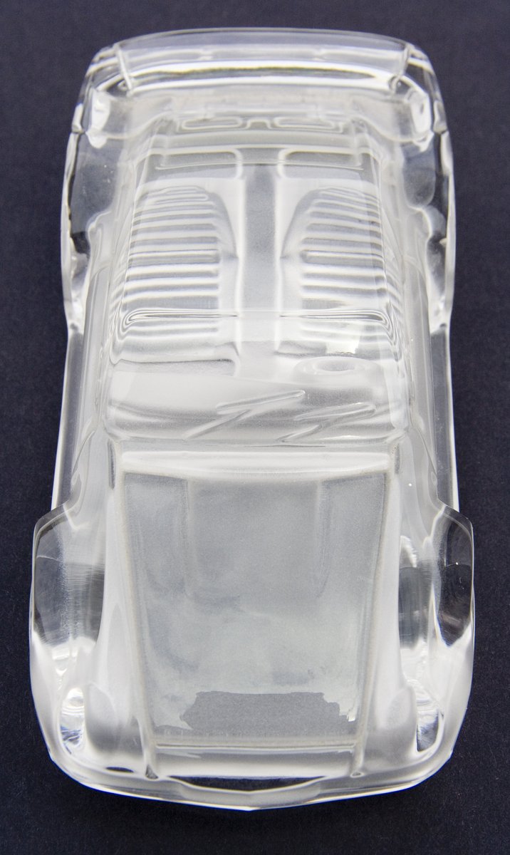 a clear plastic vehicle type object with no background