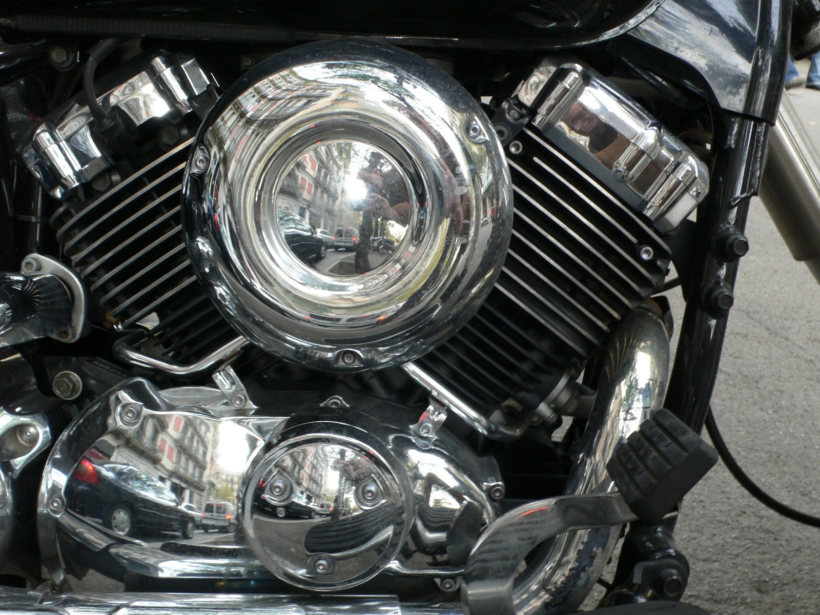 the front lights and engine of a motorcycle