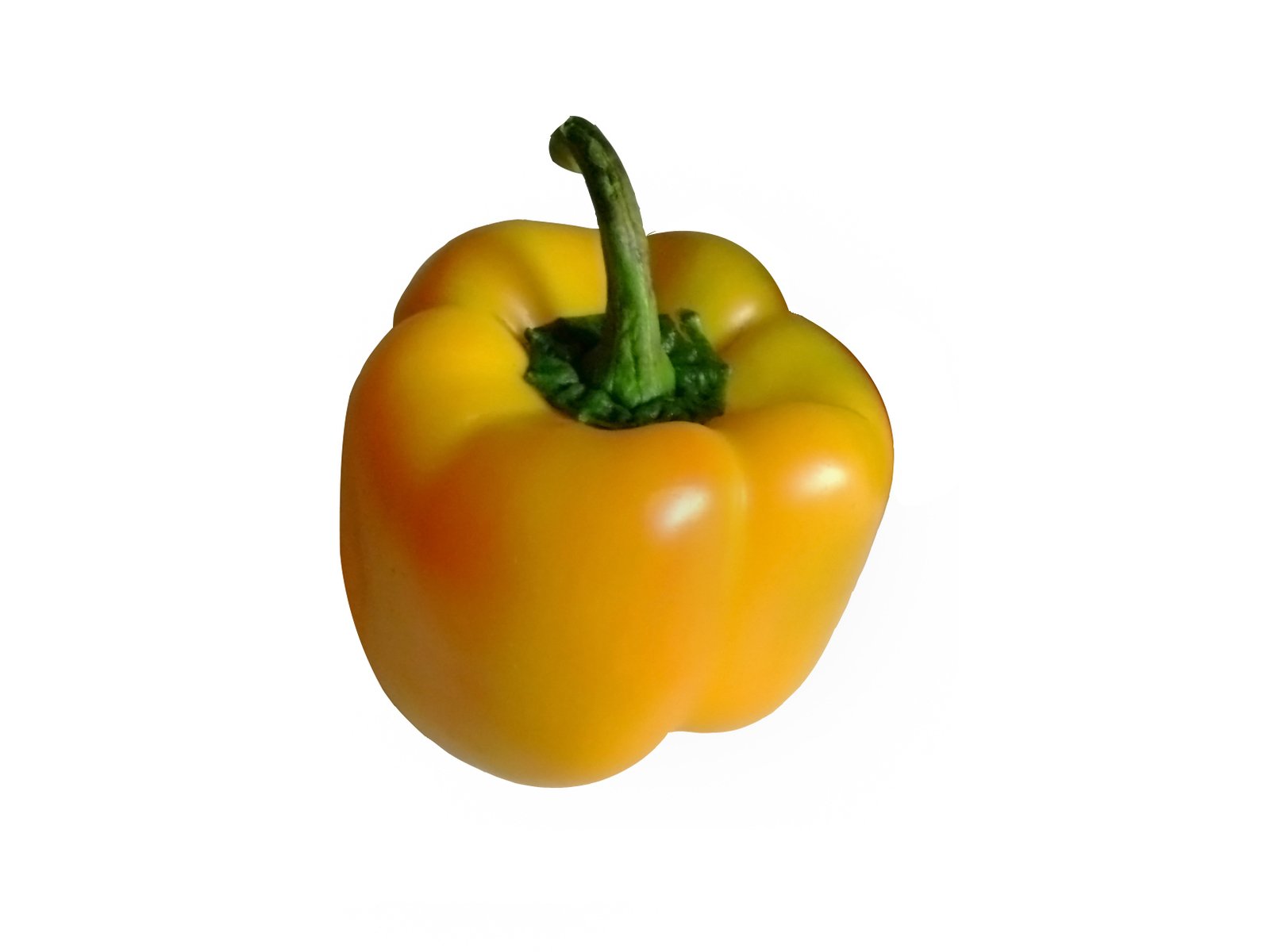 a small orange bell pepper on a white surface