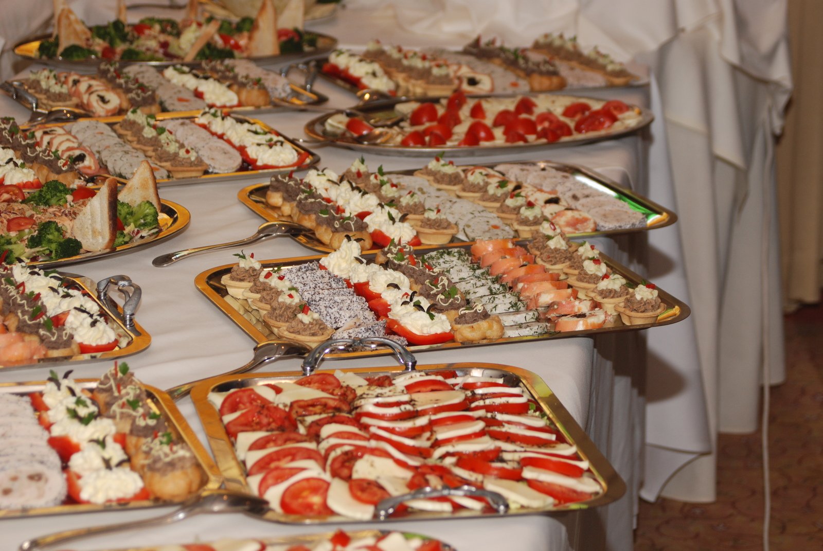 a table full of fancy appetizers and breads