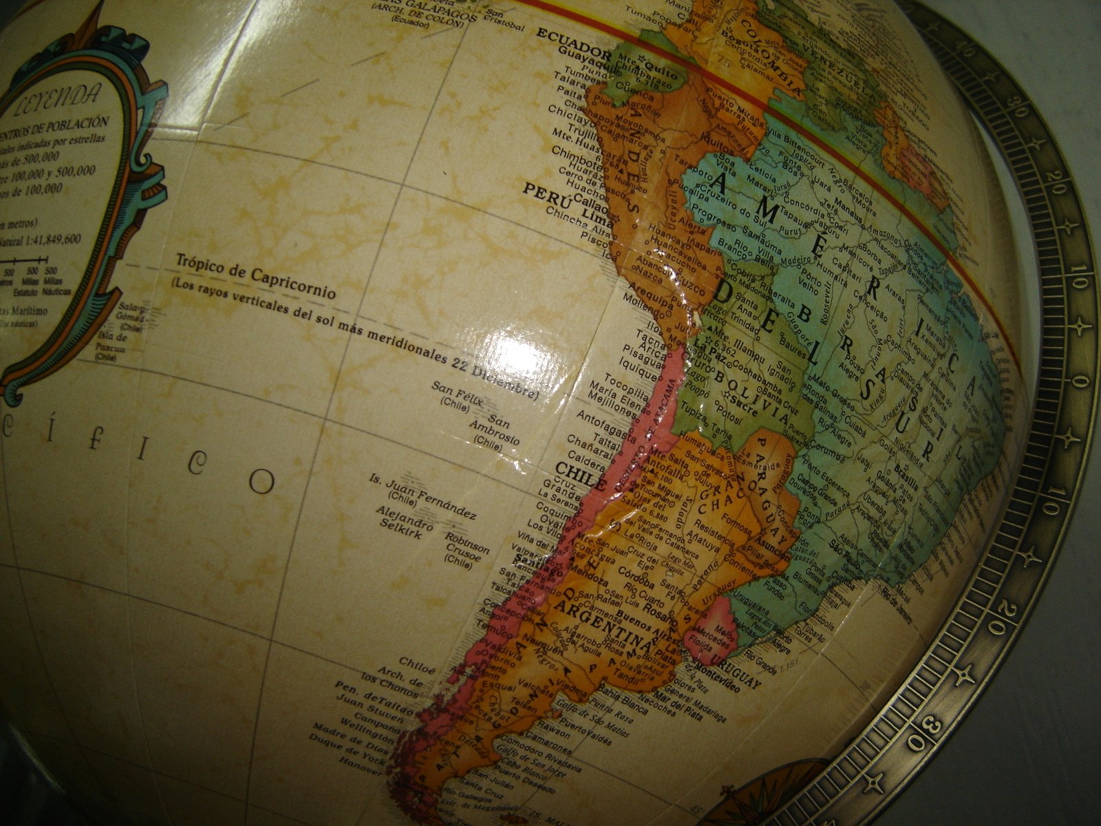 an antique style globe with colored maps on it