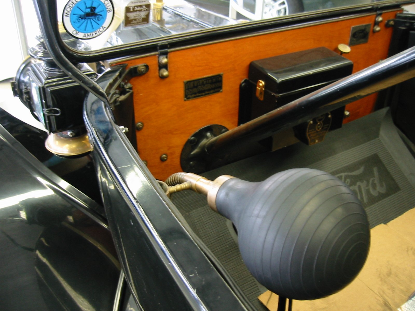 an old vehicle with a large, rubber steering wheel