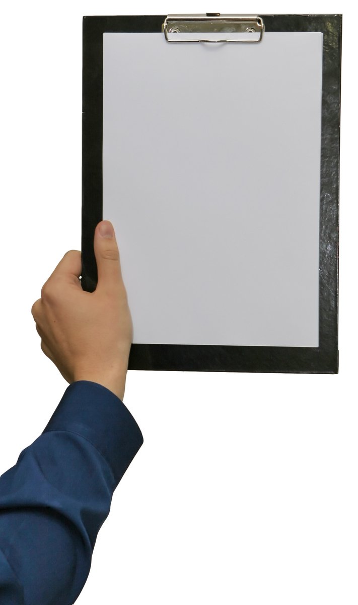 a person holding up a clipboard with a clip