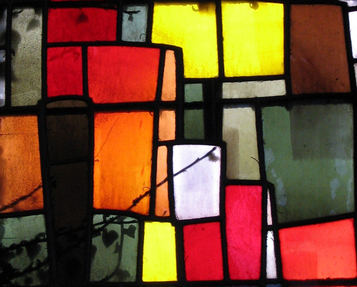 a colorful stain glass window featuring various colors