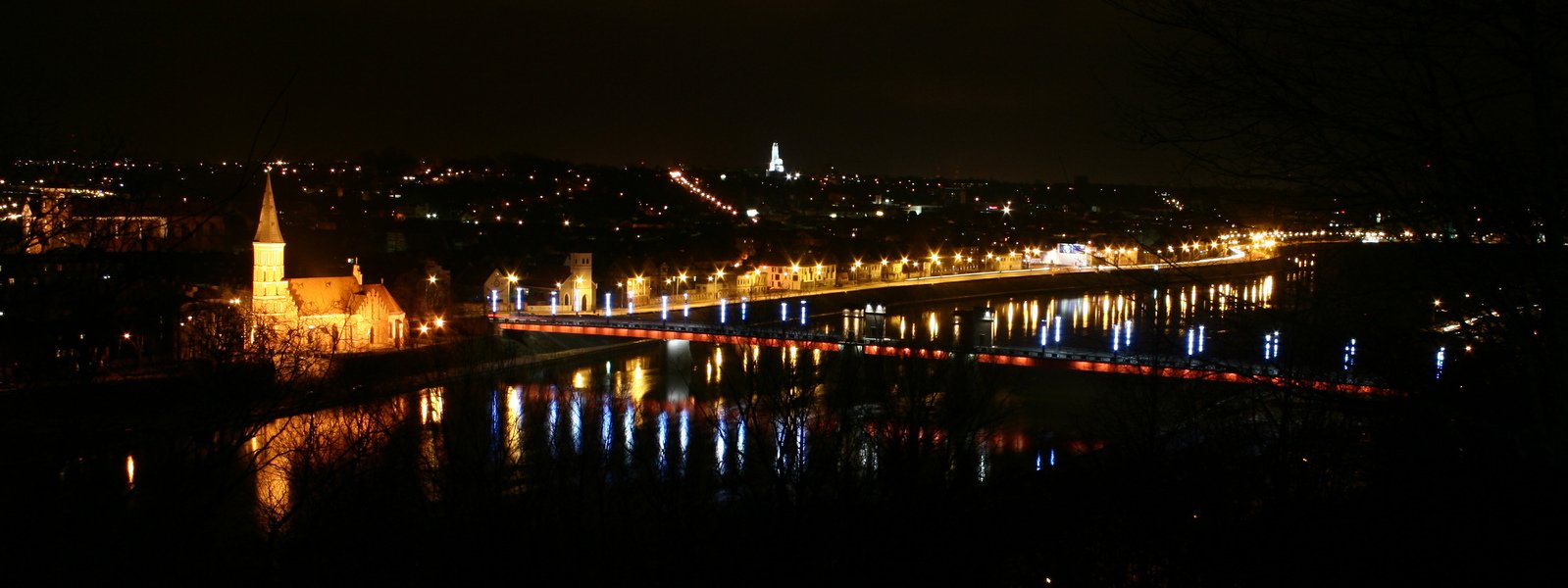 night view of the city lights and a bridge