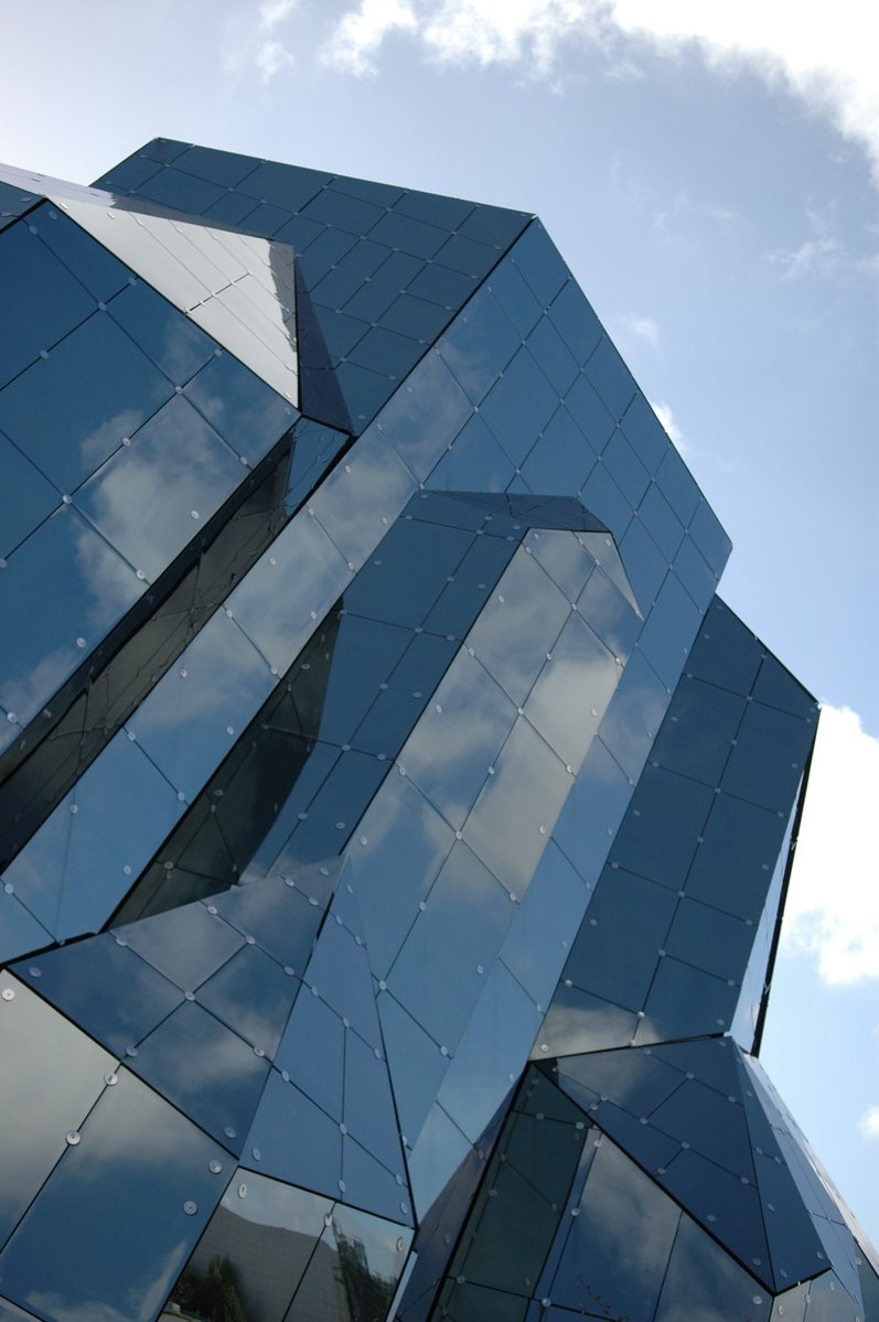 a very tall glass structure with many windows
