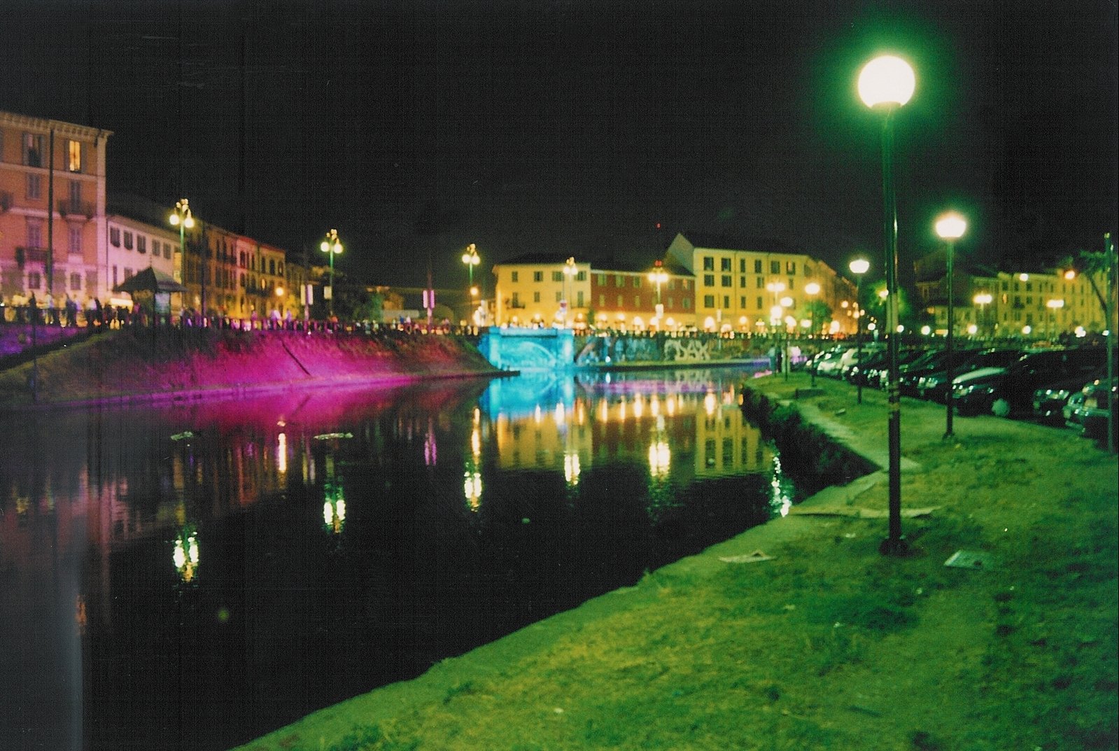 a canal at night time on a city street