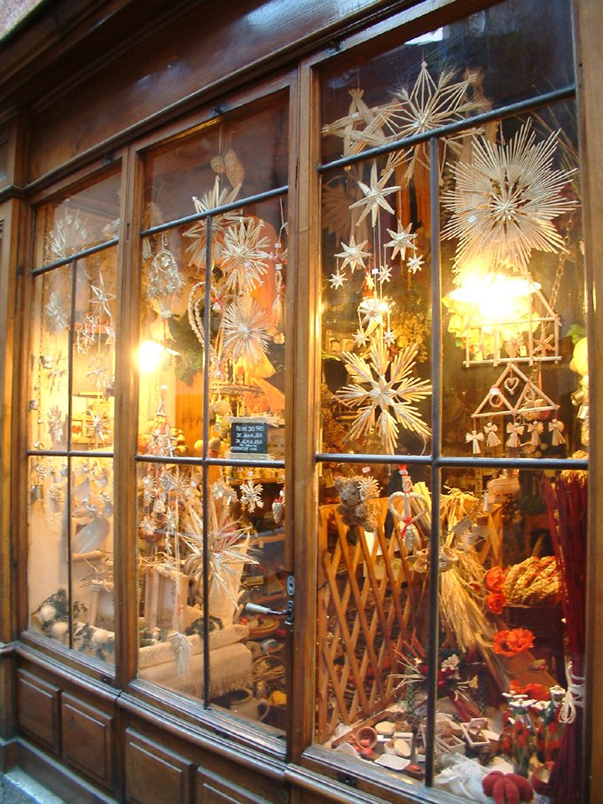 a shop window that has many snowflakes in it