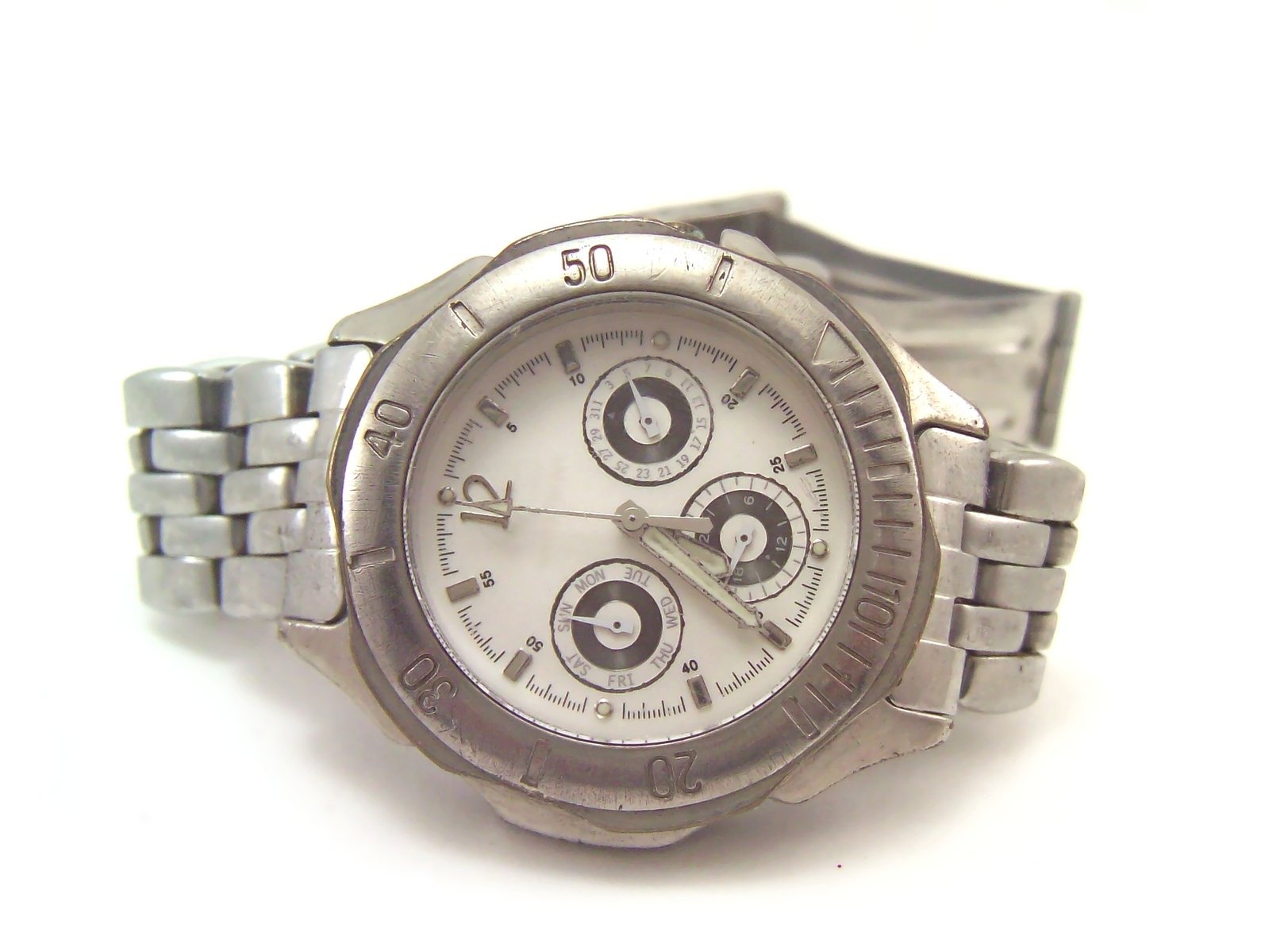 the watch is stainless steel and has white dials