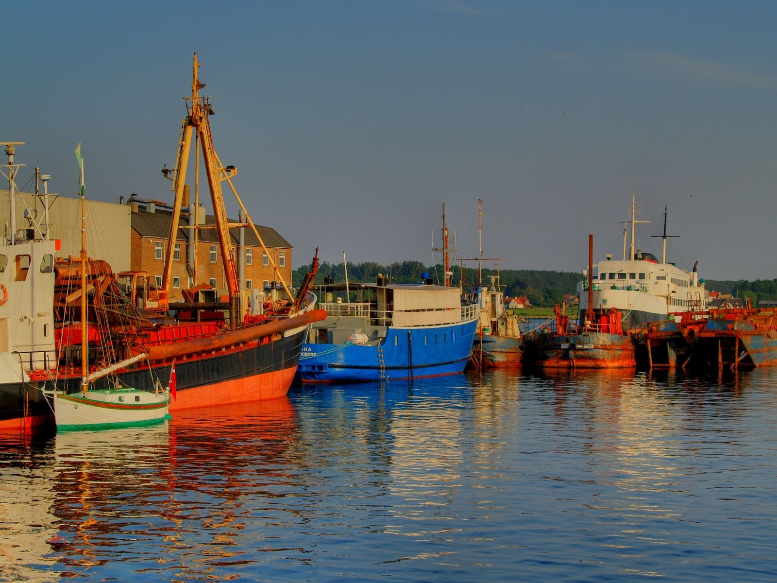 there are several fishing boats at the dock