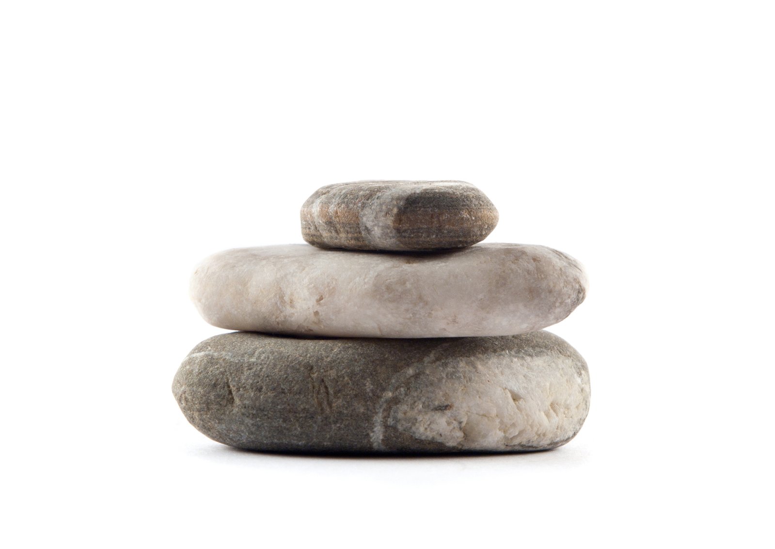 two large stones stacked on each other in front of a white background