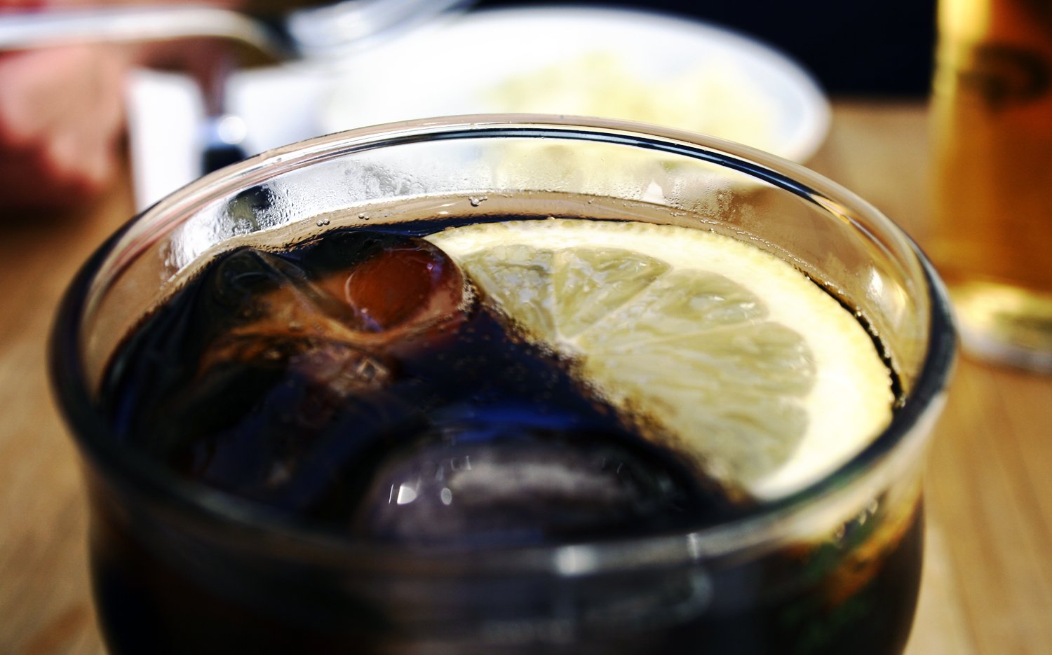 soda in a cup with lemon slices and blue liquid