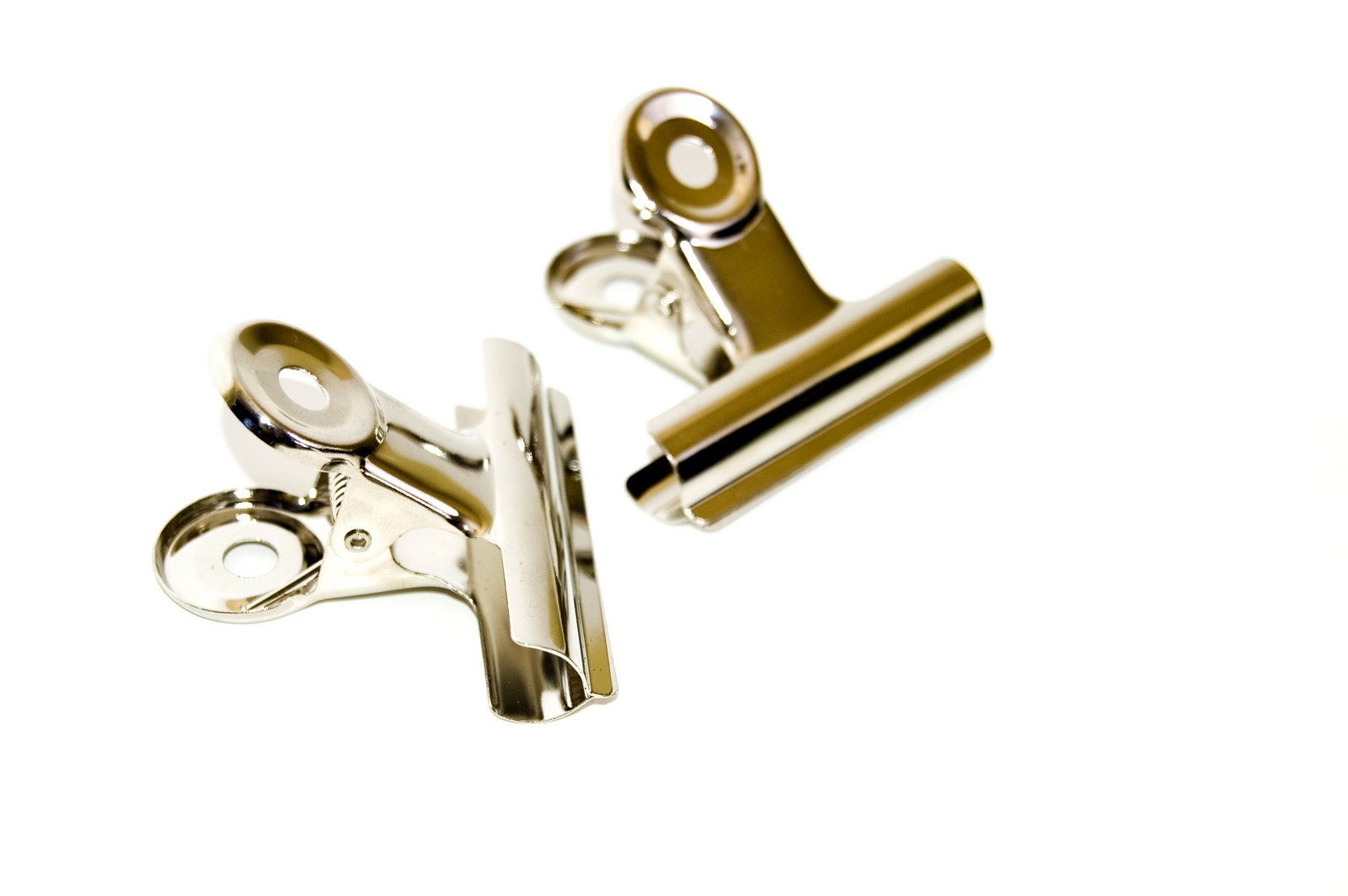 pair of metal clippers in motion against a white background
