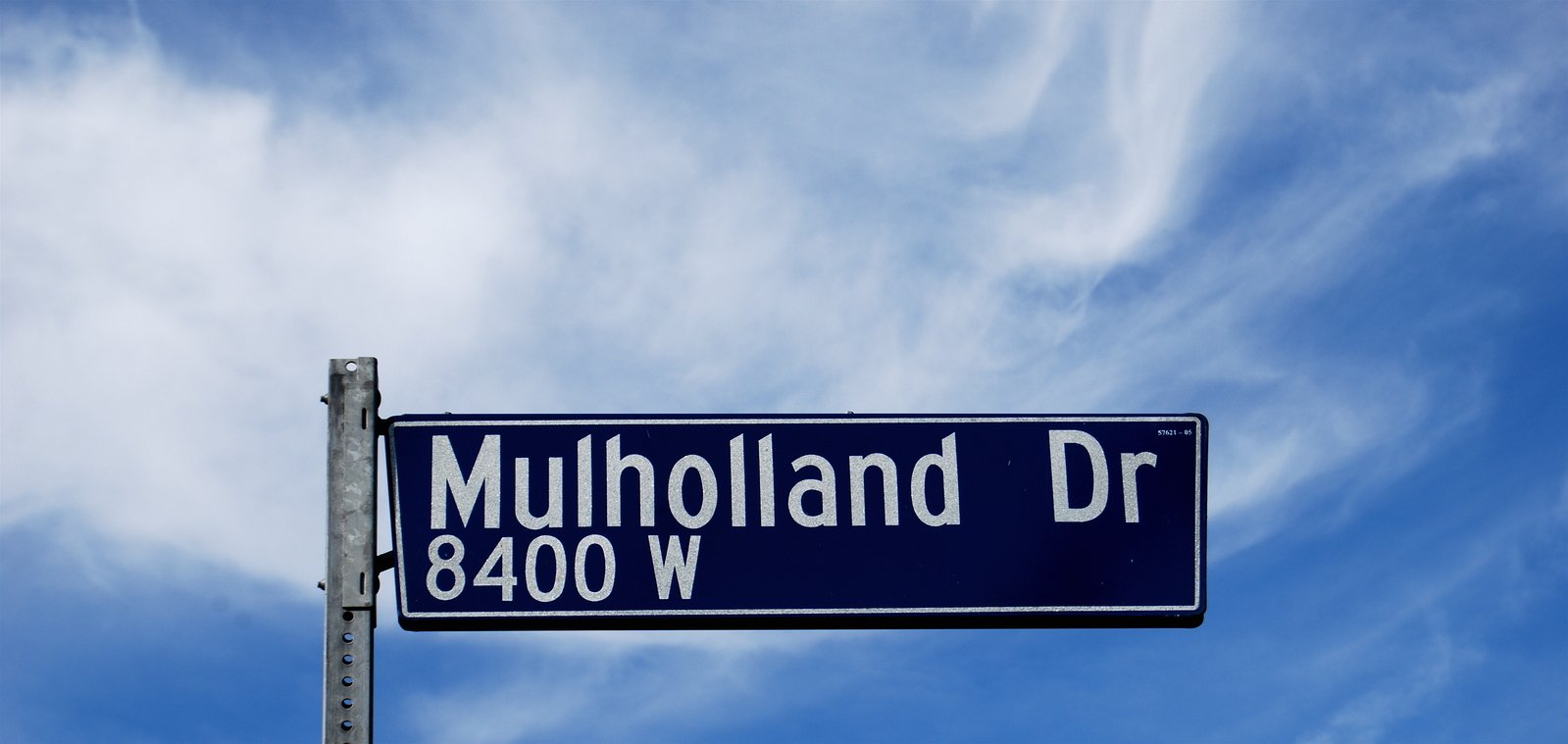 a street sign for the intersection of mulholland drive and 4800 w