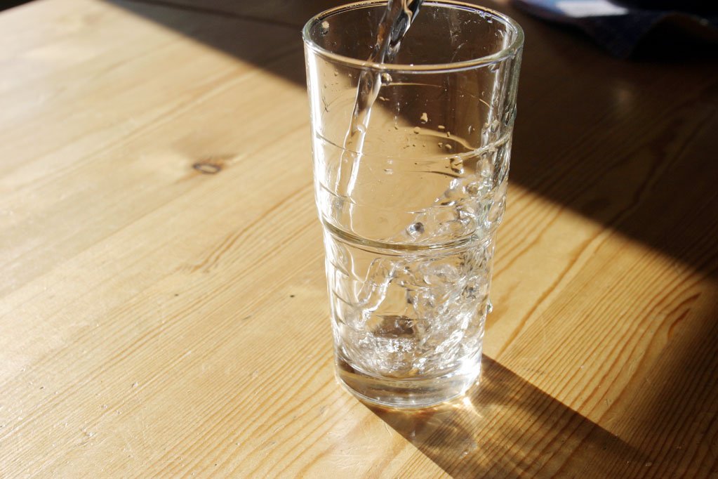 an image of a glass of water being filtered