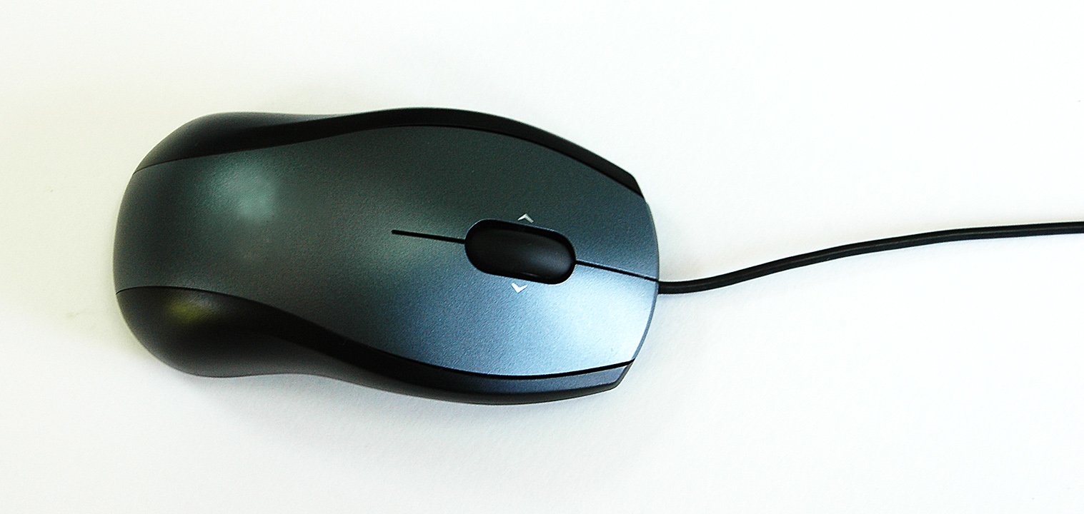 a computer mouse sits empty on the table